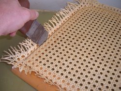 Pressing the rattan webbing into the groove of a Breuer Seat